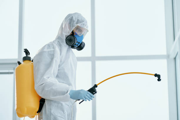 istock man in a bacteriological protection suit standing in the office 1329219876