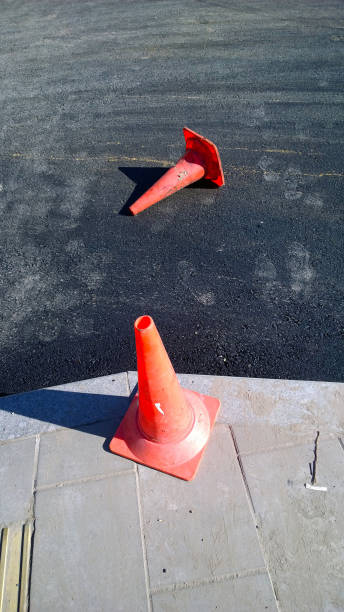 istock Plastic red traffic cones. Road traffic barrier. Pylons for traffic control. Construction site. Repair work. Channelizing devices. Restoration and reconstruction. Traffic barrier. Economic crisis. 1329226164