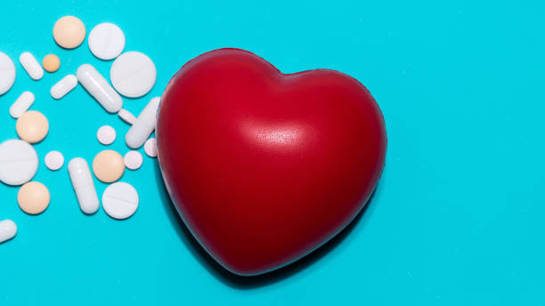 istock red heart and pills on a blue background 1329234257