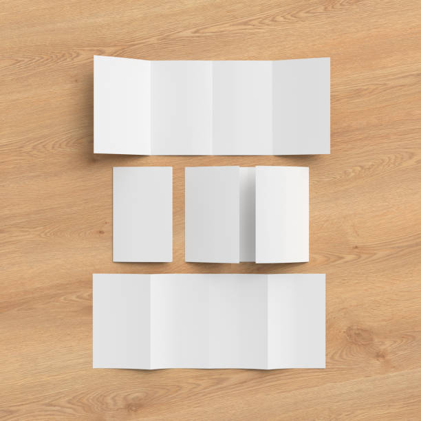istock Vertical double gate fold brochure. Four panels, eight pages blank leaflet. Mock up on wooden background for presentation design. Folded, semi-folded, front and back side. 1329236569