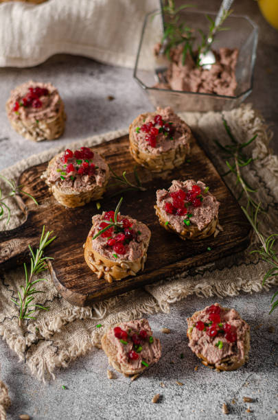 Homemade pate on heathy bread with cranberries Delicious homemade pate with wholegrain pastry and herbs heathy snack stock pictures, royalty-free photos & images