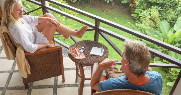 istock Mature couple relax on luxury hotel balcony 1329242990