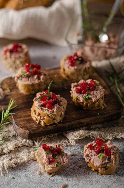 Homemade pate on heathy bread with cranberries Delicious homemade pate with wholegrain pastry and herbs heathy snack stock pictures, royalty-free photos & images