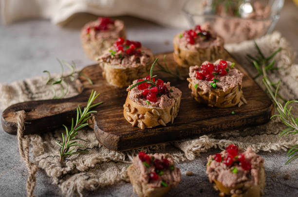 Homemade pate on heathy bread with cranberries Delicious homemade pate with wholegrain pastry and herbs heathy snack stock pictures, royalty-free photos & images