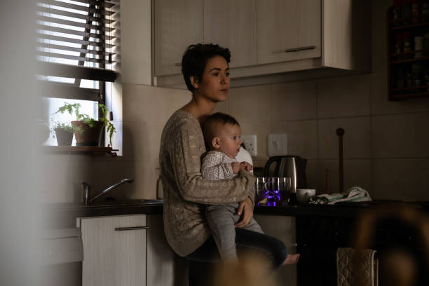 istock Mother with two kids trying to multi-task 1329249741