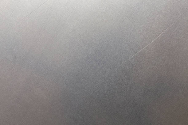 istock Uncoated flat cold rolled steel sheet surface with few minor scratches. Close-up in directly above composition. 1329250276