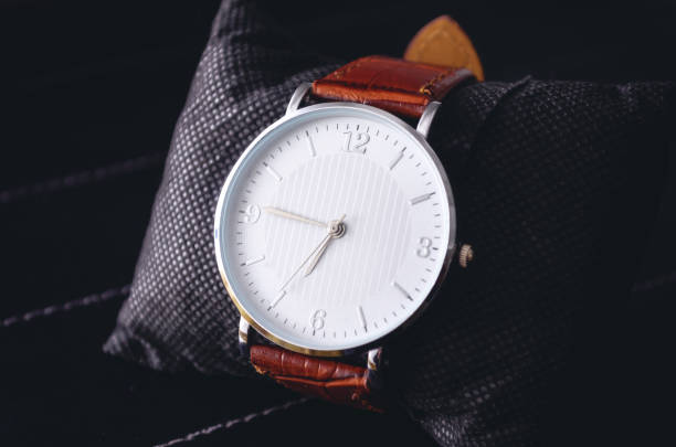 istock Stylish watch on a black background 1329250282