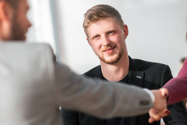 istock HR Manager shaking hands with young job seeker 1329251418