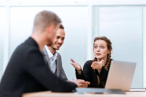 istock young business colleagues sitting at the office Desk 1329251449