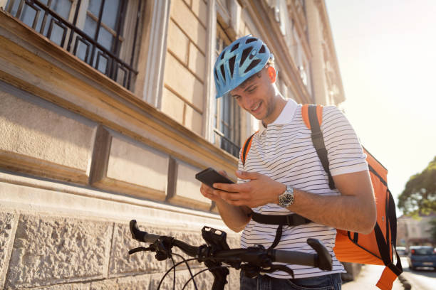 istock One delivery man checking his delivery address 1329254845