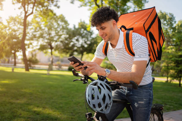 istock Delivery man checking his delivery address 1329254853