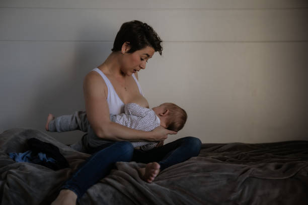 istock Mother with two kids trying to multi-task 1329254987