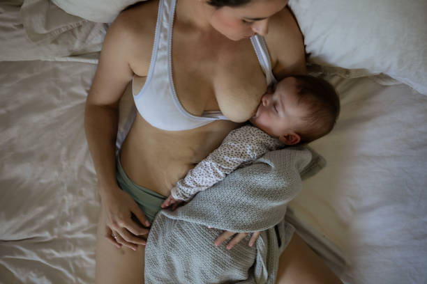 istock Mother with two kids trying to multi-task 1329256693
