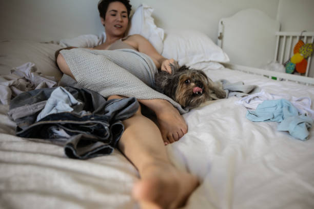 istock Mother at home postpartum with stretch marks from giving birth 1329257049