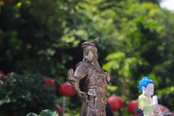 Guan Gong Warlord statue with a defocused background at Thailand Buddhism Shrine Nam Hai Kwan Se Im Pu Sa Vihara Sukabumi, Indonesia.