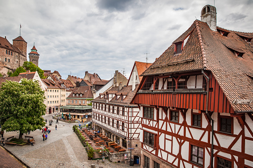 Nuremberg, Germany - May 17, 2016:  Square in the old town of Nuremberg near Kaiserburg Imperial Castle. Landmark of the city, cityscape