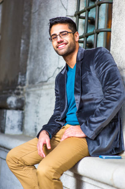 istock Portrait of Young Man sitting outside, relaxing, thinking 1329258936