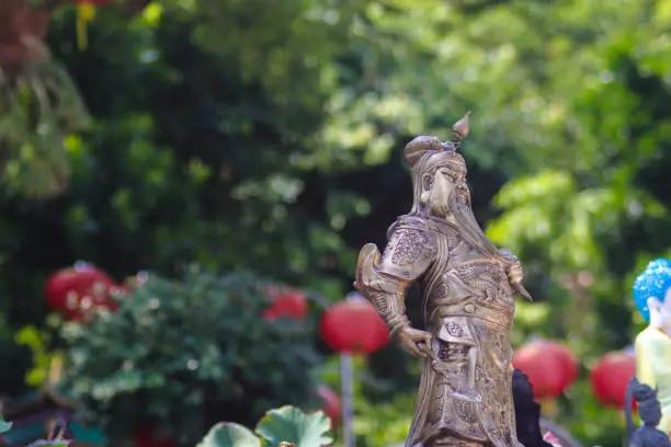 Guan Gong Warlord statue with a defocused background at Thailand Buddhism Shrine Nam Hai Kwan Se Im Pu Sa Vihara Sukabumi, Indonesia.