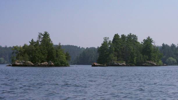 istock Two small rocky tree covered islands, Shagawa Lake, Ely, MN 1329263403