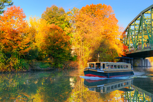 Canal Boat and bridge with fall leaf color-Pittsford, New York