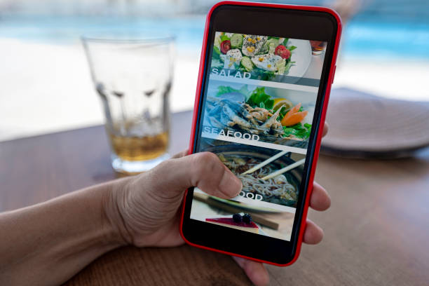 istock Woman using mobile app to order food. 1329268996