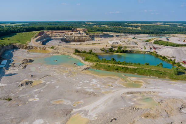 istock Panoramic aerial view on stone extraction in the canyon with small lakes formed by mining activities 1329269651