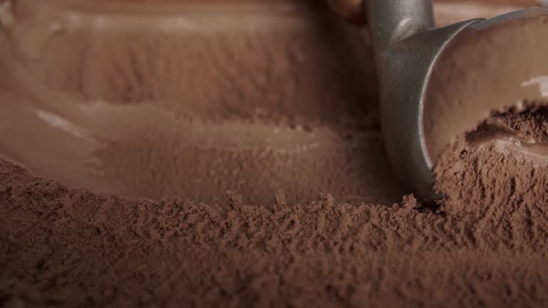 Scooping Chocolate flavor ice cream.