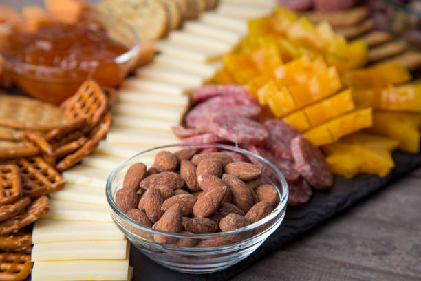 istock Full platter with meats, cheese, nuts, crackers and an apricot spread. 1329273477