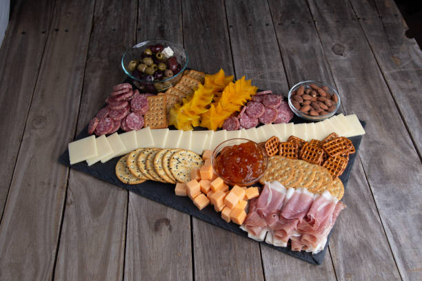istock Full platter with meats, cheese, nuts, crackers and an apricot spread. 1329273480