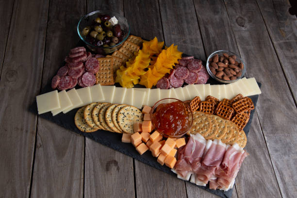 istock Full platter with meats, cheese, nuts, crackers and an apricot spread. 1329274029