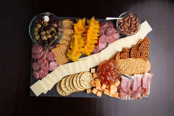 istock Full platter with meats, cheese, nuts, crackers and an apricot spread. 1329274038