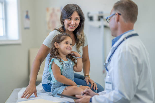 istock Mother and daughter go to doctor's appointment 1329277282