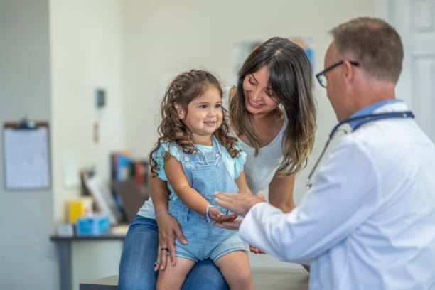 istock Mother and daughter go to doctor's appointment 1329277290