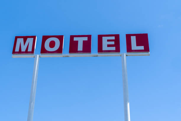 istock Generic sign for a motel against blue sky. Red and white lettering 1329278408