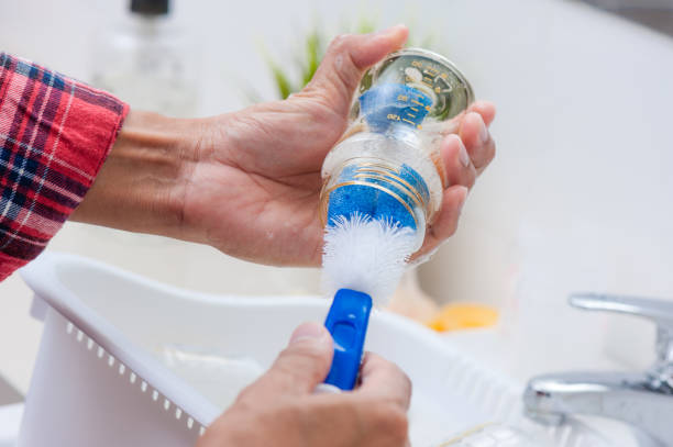 istock Washing baby bottles and nipples 1329279091