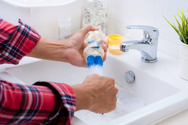 istock Washing baby bottles and nipples 1329279146