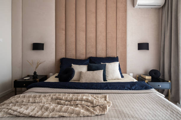 istock Elegant bedroom with upholstered wall 1329279310