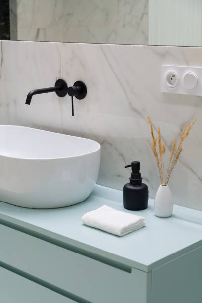 istock Close-up on stylish decorations next to modern washbasin 1329279317