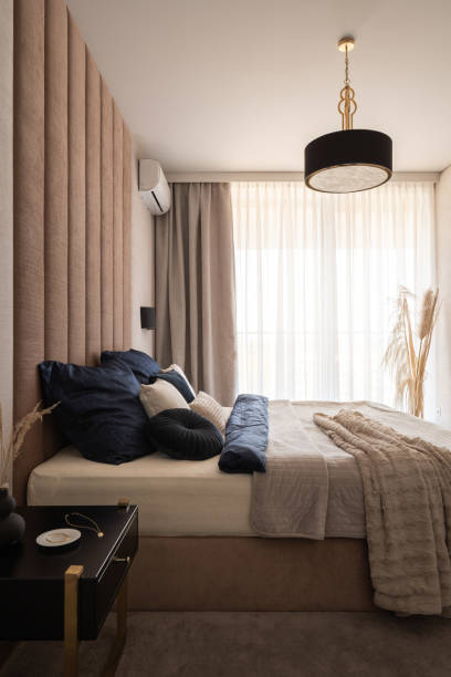 istock Bright and elegant bedroom with big window 1329279343