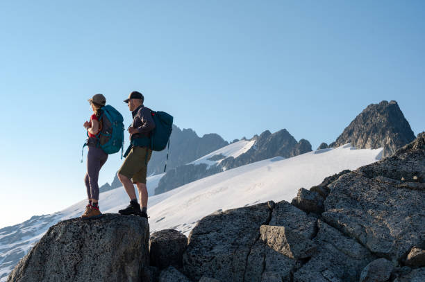 istock Couple hiking in the mountains 1329282073