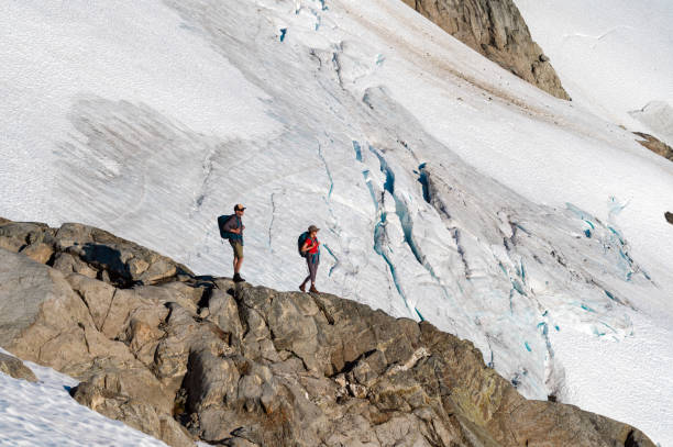 istock Couple hiking in the mountains 1329282105