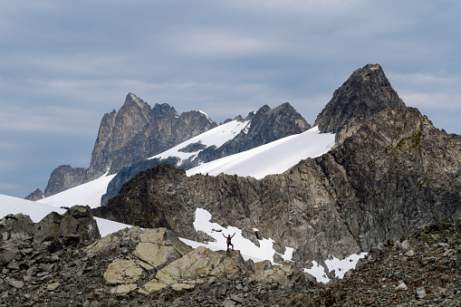 Woman enjoying solo travel in nature. Living an active lifestyle. Hiking in the Tantalus Range of British Columbia.