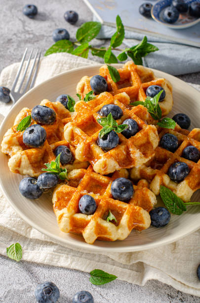 istock Homemade waffles with berries 1329283487