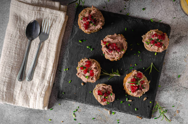 Homemade pate on heathy bread with cranberries Delicious homemade pate with wholegrain pastry and herbs heathy snack stock pictures, royalty-free photos & images