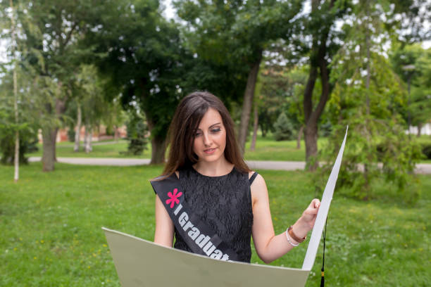 istock Excited young woman on graduation day 1329296214