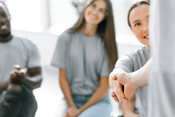 istock young employees greeting each other with a handshake 1329301426