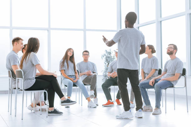 istock group of young people applauding at a business training 1329301446