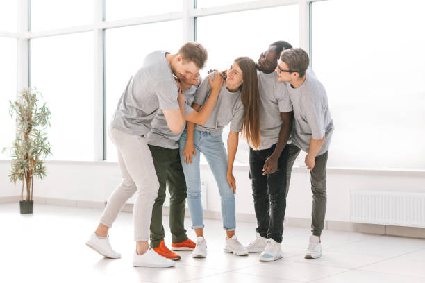istock group of friends standing in a bright spacious hall 1329301560