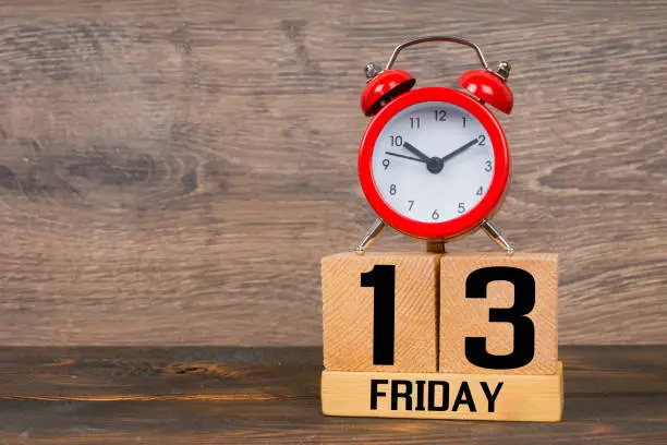 friday 13, wooden blocks calendar with red alarm clock