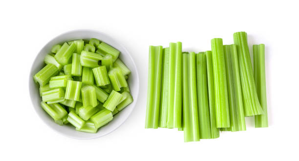 istock Top view of celery in white bowl isolated on white 1329302943